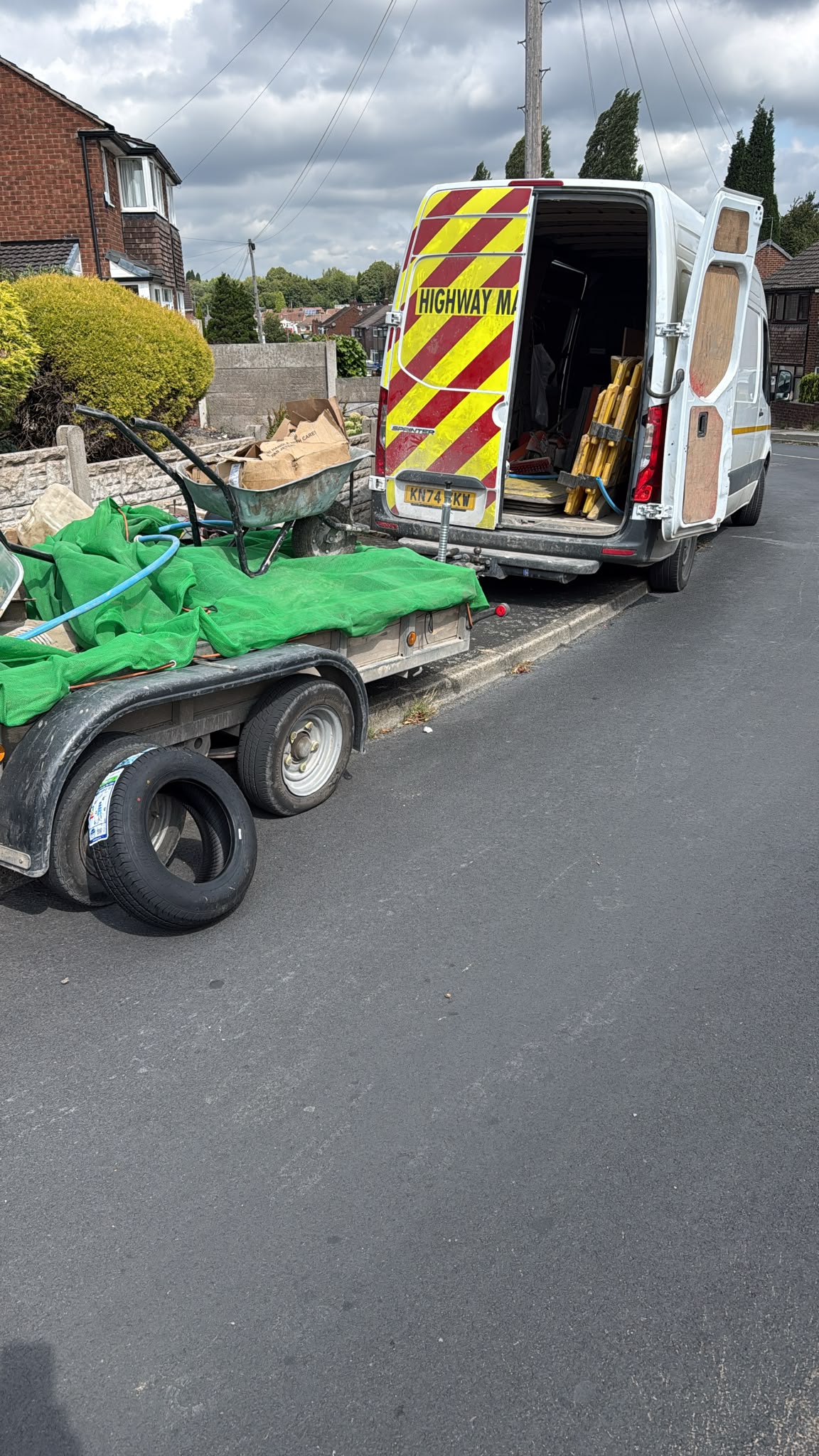 Service van and trailer parked during a daytime call-out