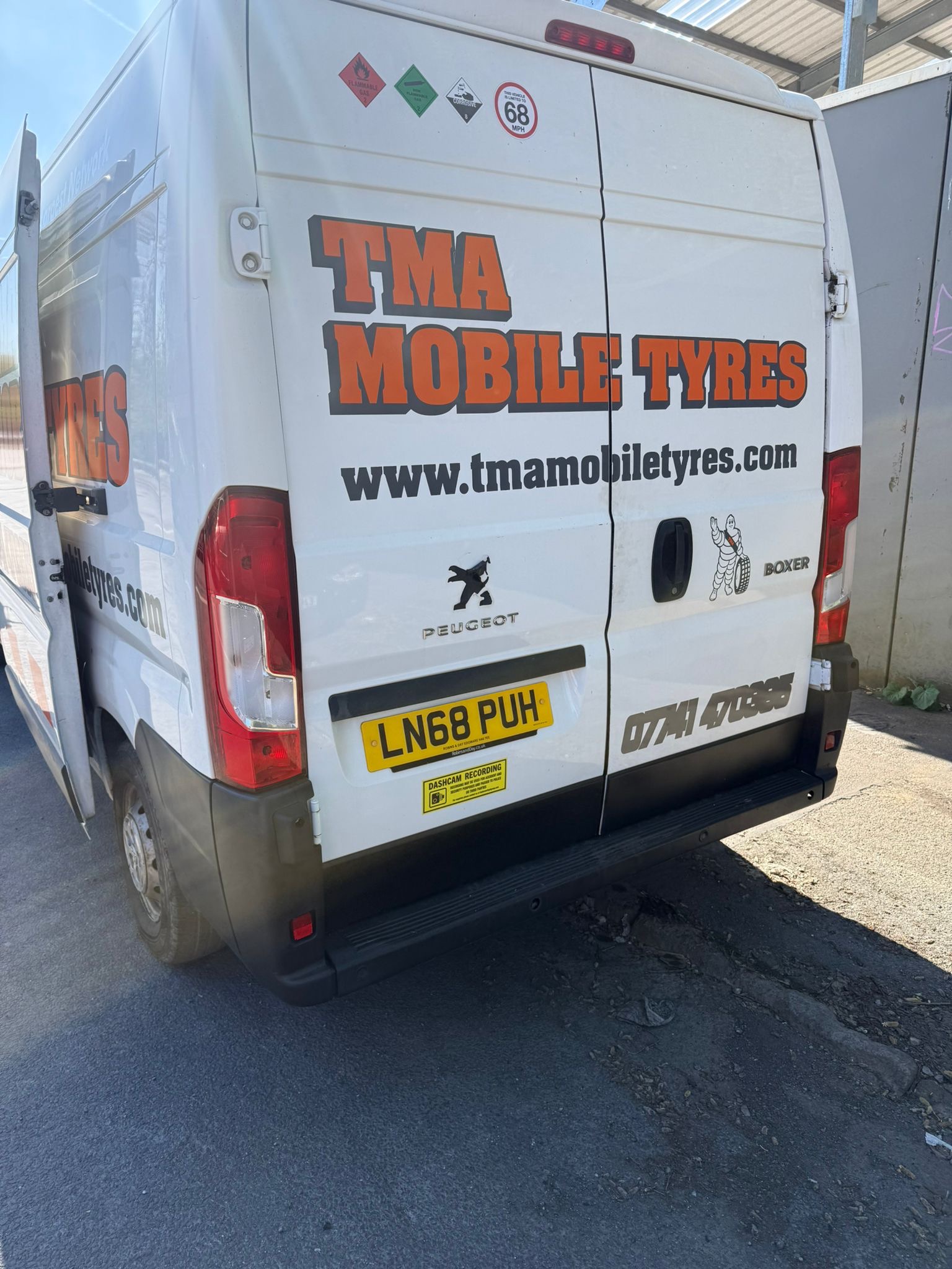 Rear view of a TMA Mobile Tyres service van