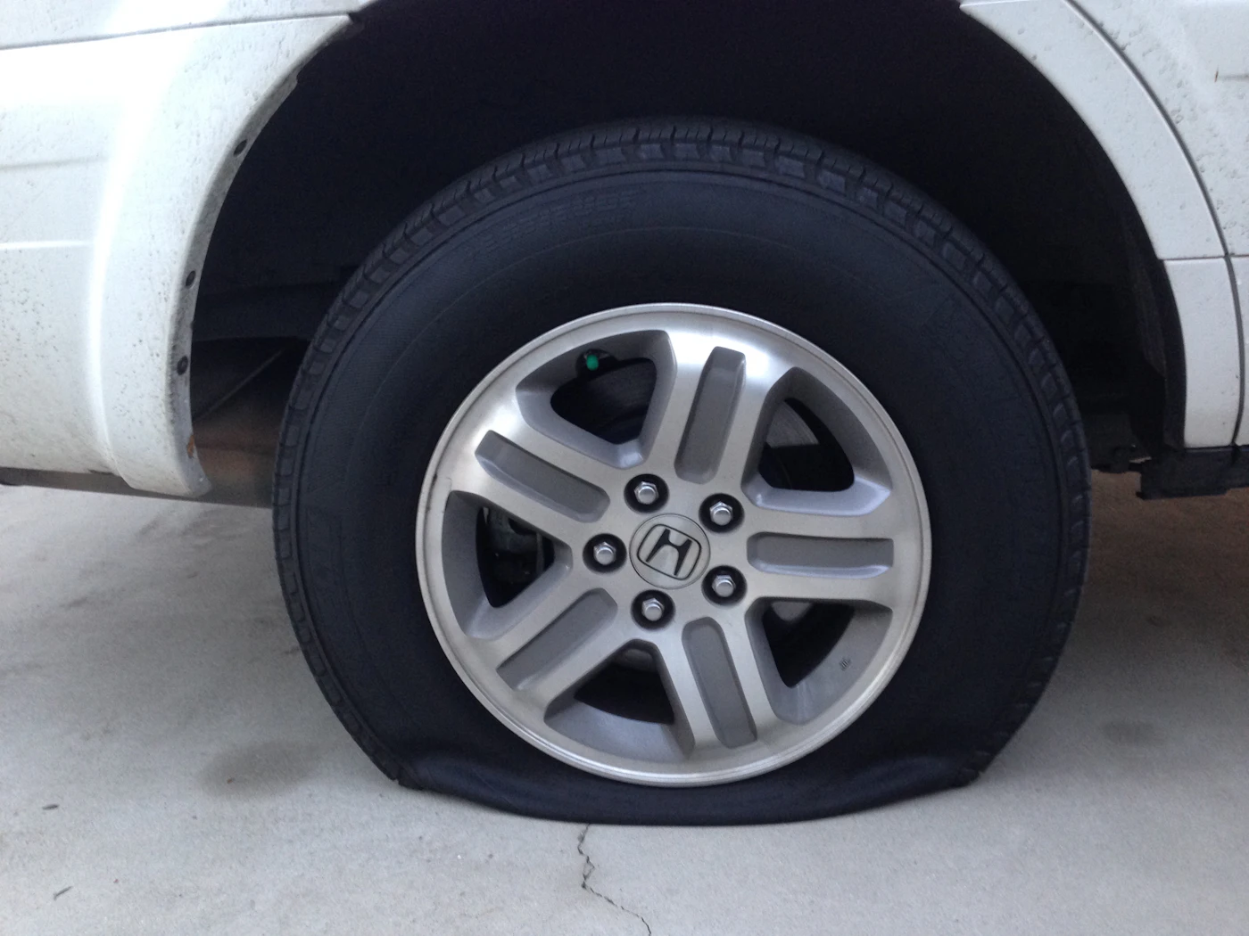 Flat car tyre requiring 24 hour emergency replacement in Bolton